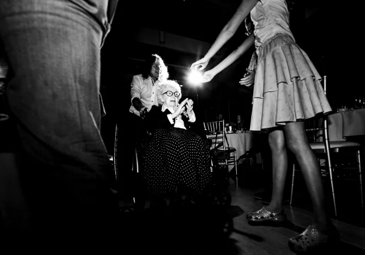 Grandmother of the bride on the wheelchair on the dance-floor