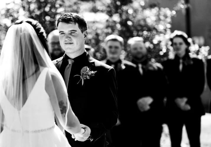 Groom and bride hold their hands at the Canadian Wedding Ceremony