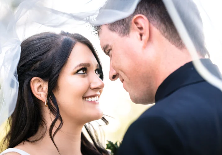 Newlyweds looking at each other with love at the Canadian Wedding