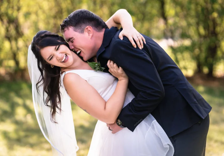 Groom tries to bit the bride's neck at the Calgary Wedding Party