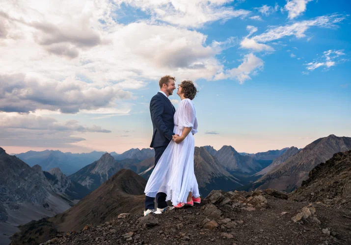Banff Elopement Photography of the newyweds holding their hands in the Canadian Rockies