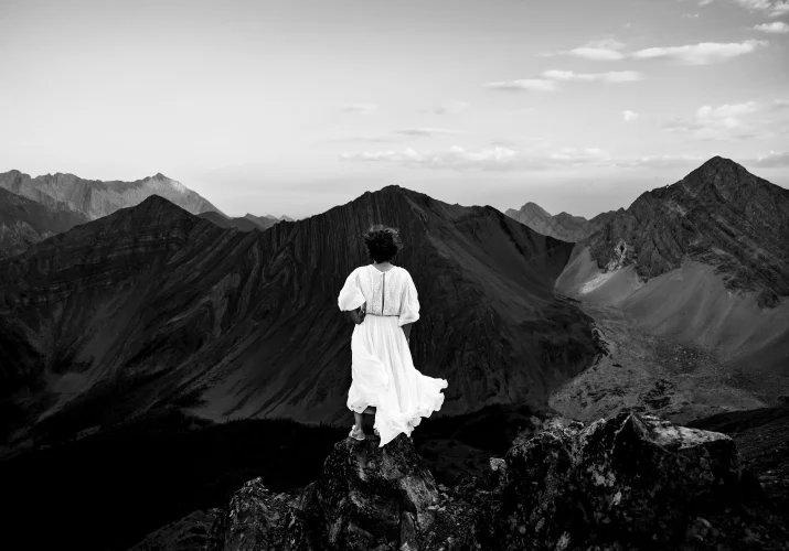 Black and White Wedding Photography of the bride looking at the Canadian Rockies