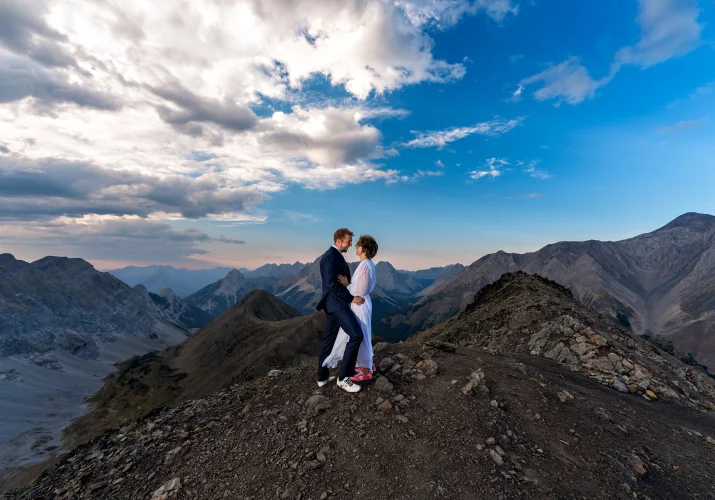 Banff Elopement Photography of the bride and groom in a hug in the mountans
