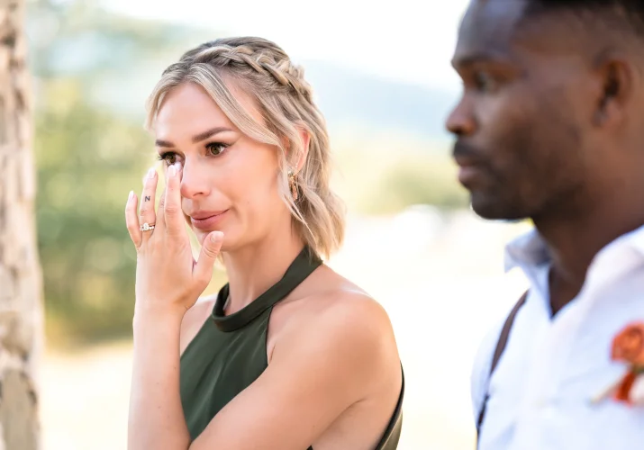 Bride of hounor whiles her tears during the wedding ceremony in Watertoon.