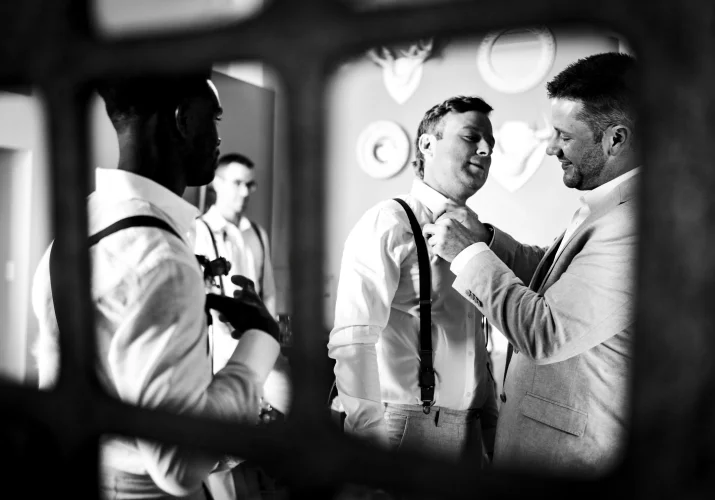 Groom helps to get ready his best friend for the Waterton wedding