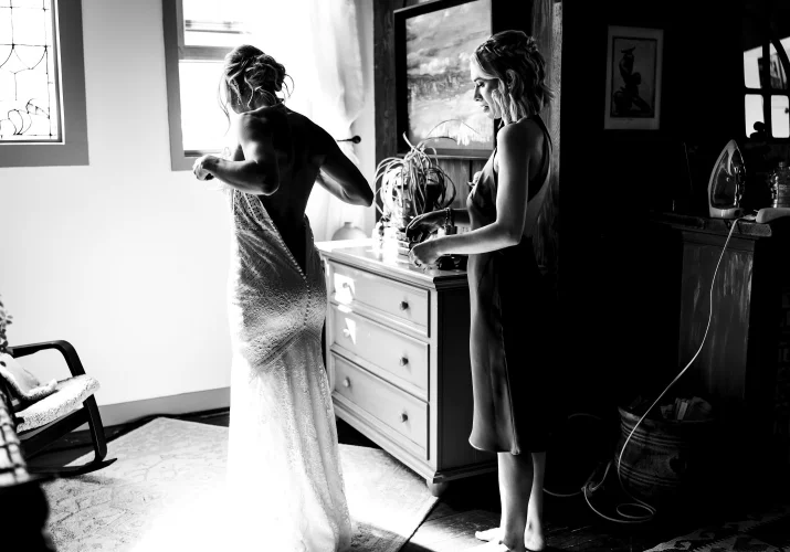 Bride put her dress on before the wedding in Waterton.