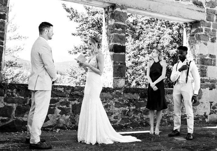 Black and white photograph of the newlyweds exchanging the vowes in Watertoon.