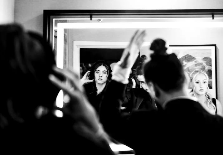 Getting ready time of the wedding party in front of the mirror before Banff Wedding Ceremony.