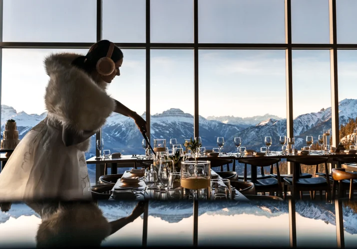 Bride lighten the candle at the wedding reception in Banff