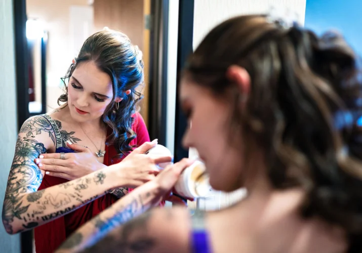 the future bride puts a cream on her tatoo