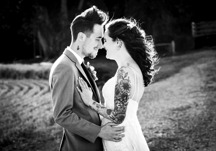 black and white Wedding Photograph of the newlyweds facing eachother.
