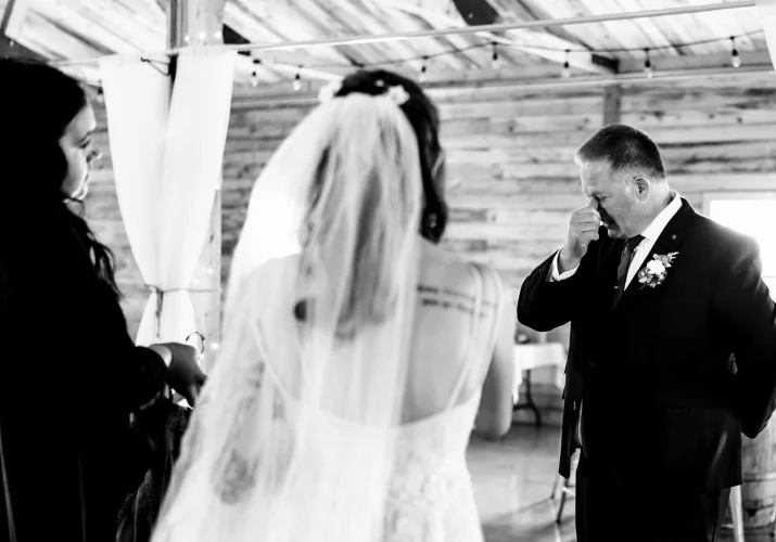 daughter - father first look before the Calgary wedding ceremony. Father cries.