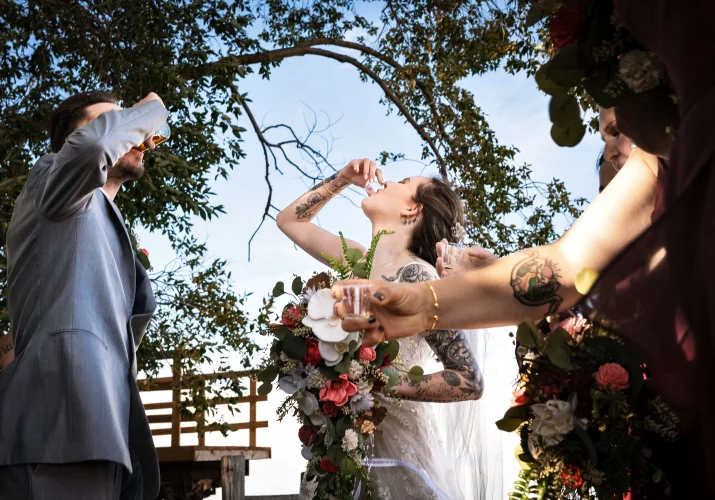 Wedding party in Calgary drinks shoots.