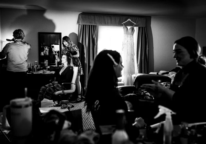 bride and bridesmaids getting hair and make up done in the hotel room in Calgary