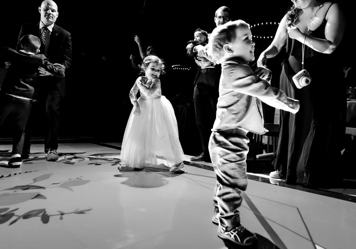 flower-girl and her little brother dance at the dancefloor