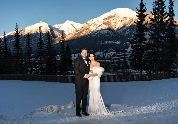 Bride and groom's portrait against Canadian Rocky Mountains in Canmore.