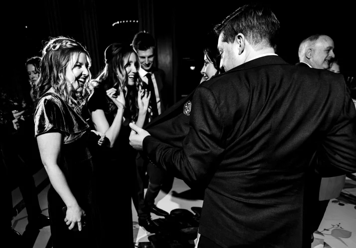 bridesmaid looking what the groom hides in the jacket