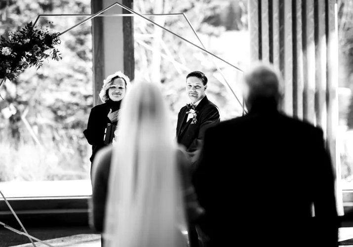 Canmore Wedding Photography on the grooms first look on bride an the Canmore Wedding Ceremony.
