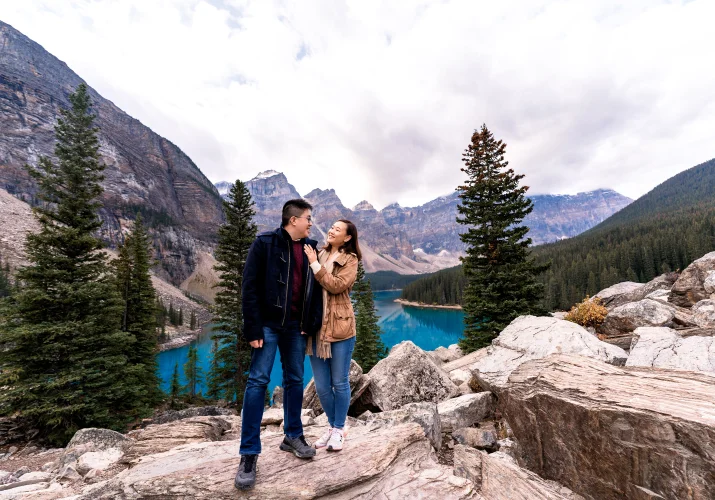 Couple in love look at each other in the mountains