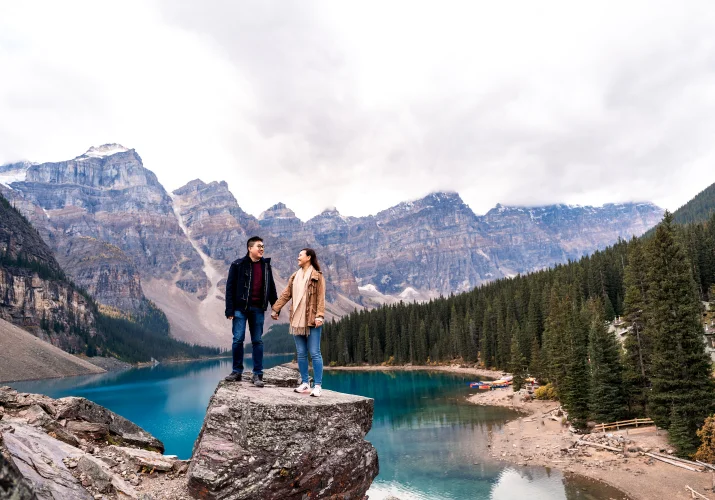 Engagement Photography of the couple holding hands against tremendous rocky mountains