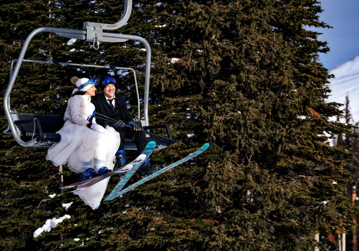 Newlyweds at the ski lift at Sunshine Village ski resort.