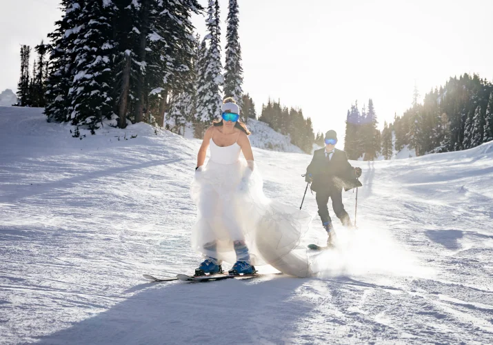 Bride and groom skiing at Sunshine Banff Vilage.