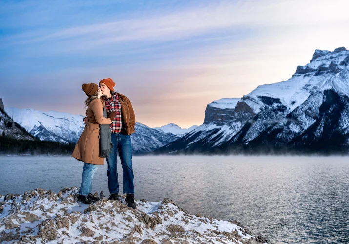 Banff Engagement Photography of the kissing couple during sunrise.