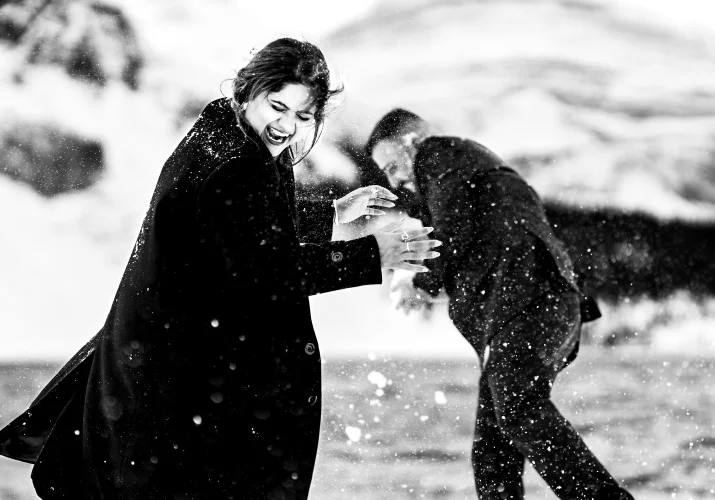 snowball fight with an engaged couple in Banff