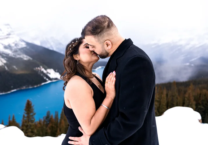 Couple in love share a kiss in Banff
