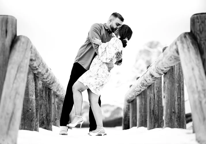 Coupe in love dance at the wooded bridge