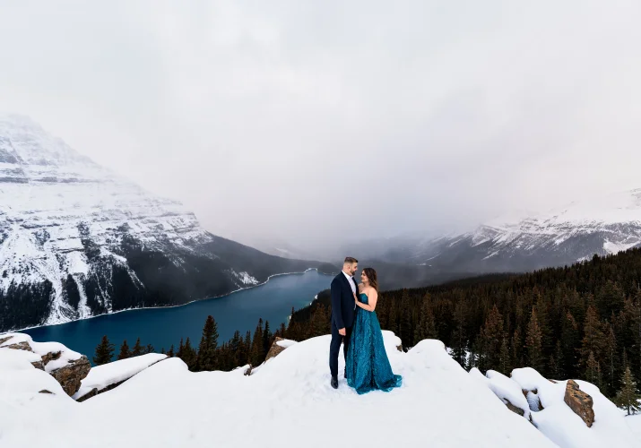 Peyto Lake Engagement Photography of the well dressed couple in a cloudy day.