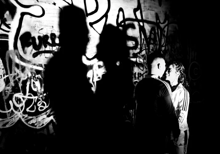 Creative engagement photography shadow of the couple facing each other.