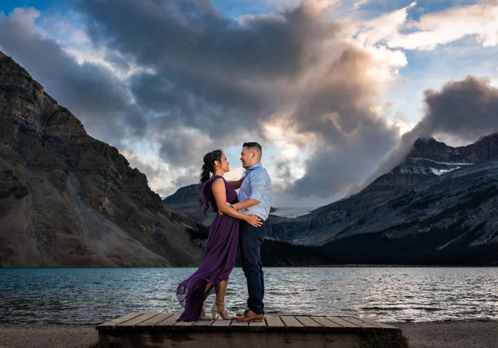 Engaged couple in a hug during stunning sunset in Banff.