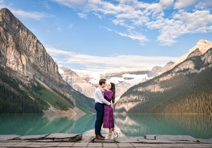Romantic Banff Wedding Photography of the engaged couple at the shore of the Lake Louise.