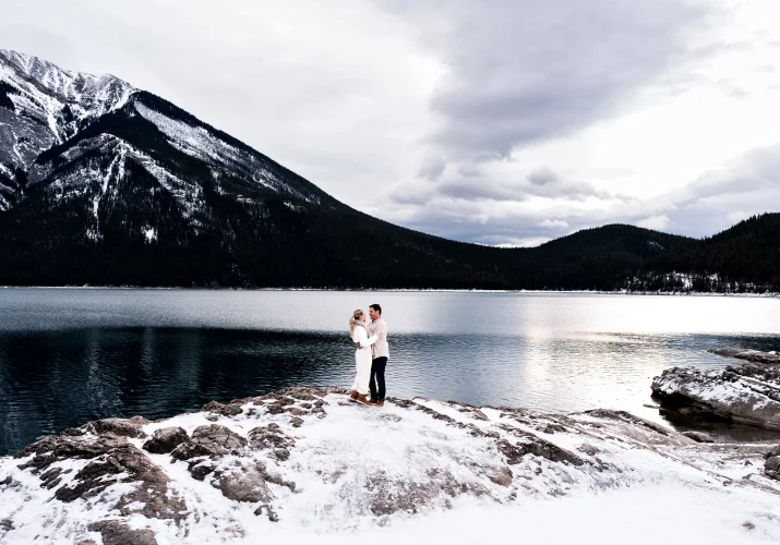 Couple in love in a hug against the Rocky Mountains
