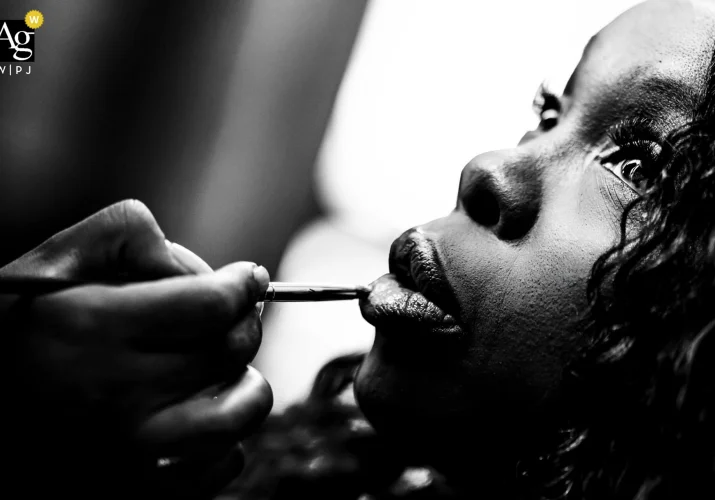The bride is getting her lips done before Calgary Wedding Ceremony.