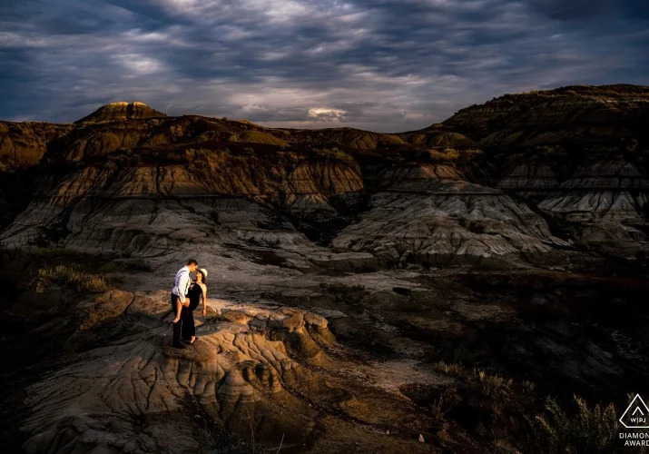 Alberta Engagement Photo at Drumheller Horseshoe Canyon of coupe dancing with passion.