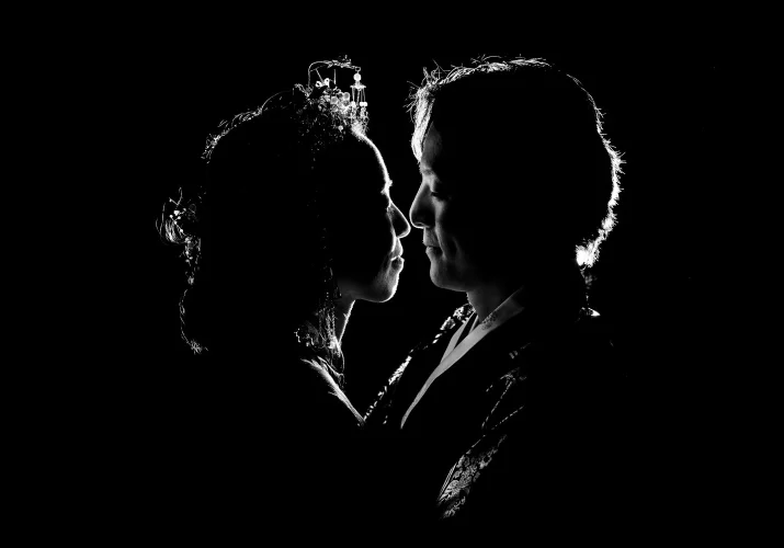 back-lighted newlyweds in black and white. Creative Photograph taken by Banff Wedding Photographer