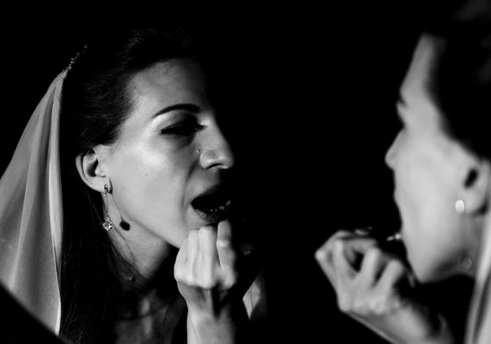 Bride's make up before winter wedding ceremony in Kananaskis Alberta