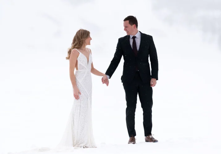 Bride and groom look at each other during their Big Day in Banff