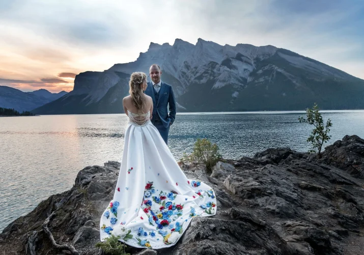 Preety wedding dress worn by bride during after wedding photo session in Canadian Rockies.