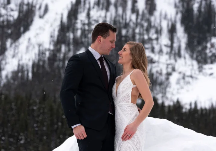 bride and groom look deeply into each others eyes during Banff Wedding Photo session