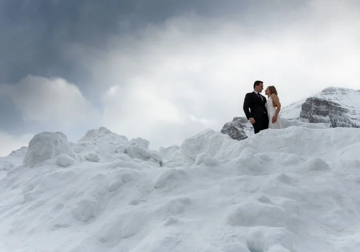 Newlyweds on the top of the mountain in Banff