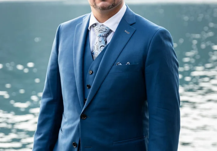 Groom's portrait at Minnewanka Lake.