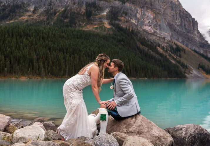 Braide kissing the groom after wedding ceremony at Lake Louise