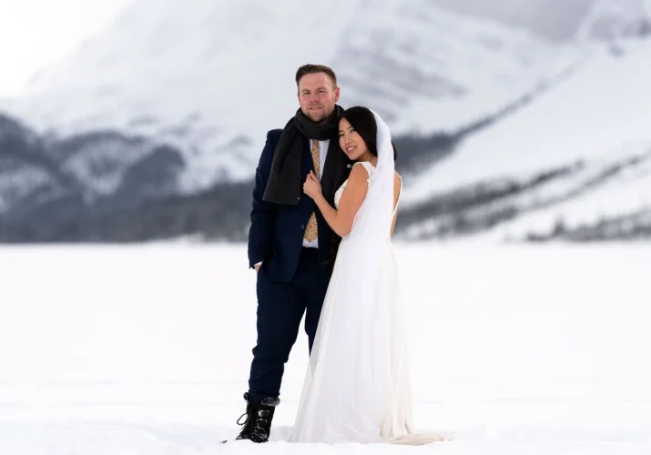 Couple posing during their wedding photo session at Bow Lake