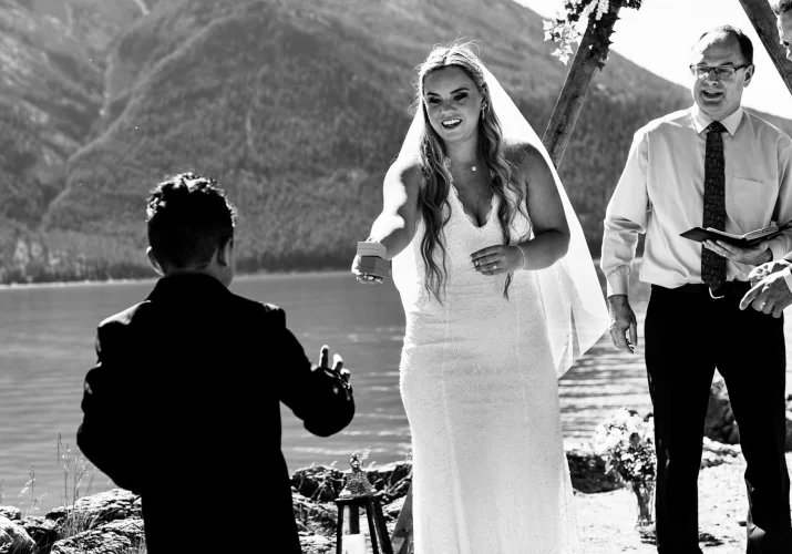 Ring boy provide the wedding rings during the elopement at Minnewanka Lake