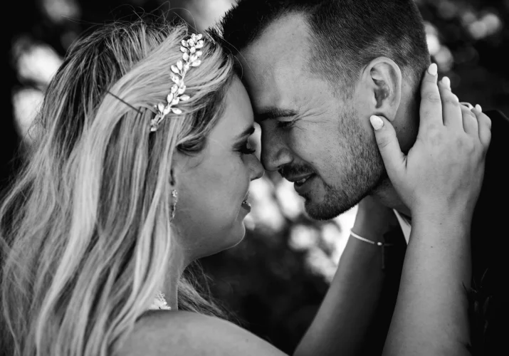 Romantic portrait after elopement ceremony in Banff. newlyweds touching their foreheads