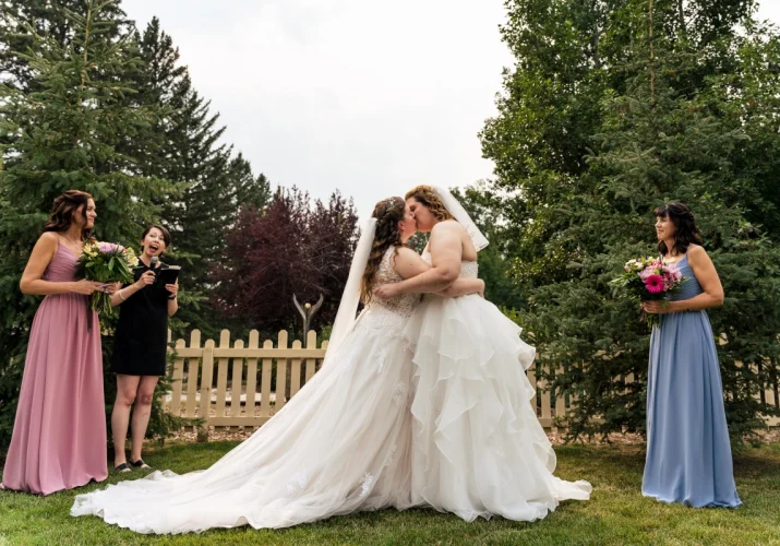 The brides are kissing affer emotional Calgary Elopement