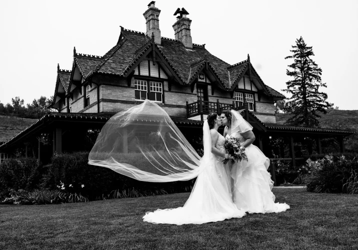 Same sex coupe kissing during their Calgary Wedding